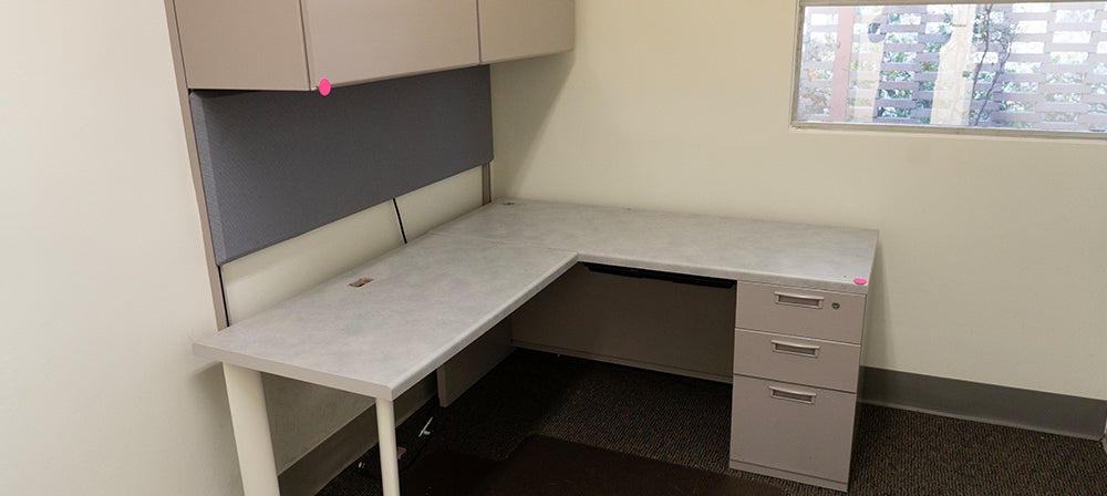 L-shaped desk with upper cabinets