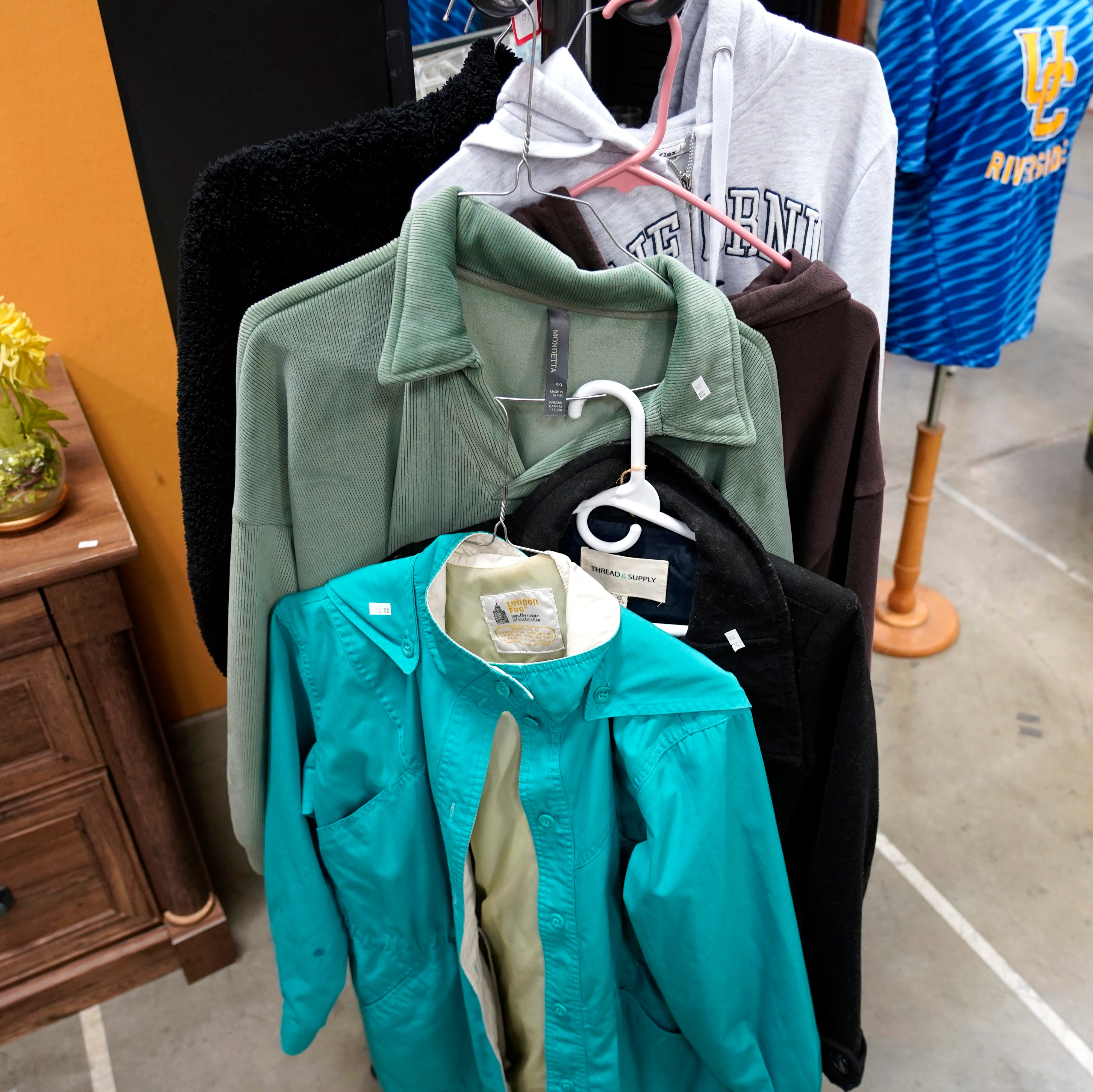 Jackets and sweaters in varying sizes, styles and colors.