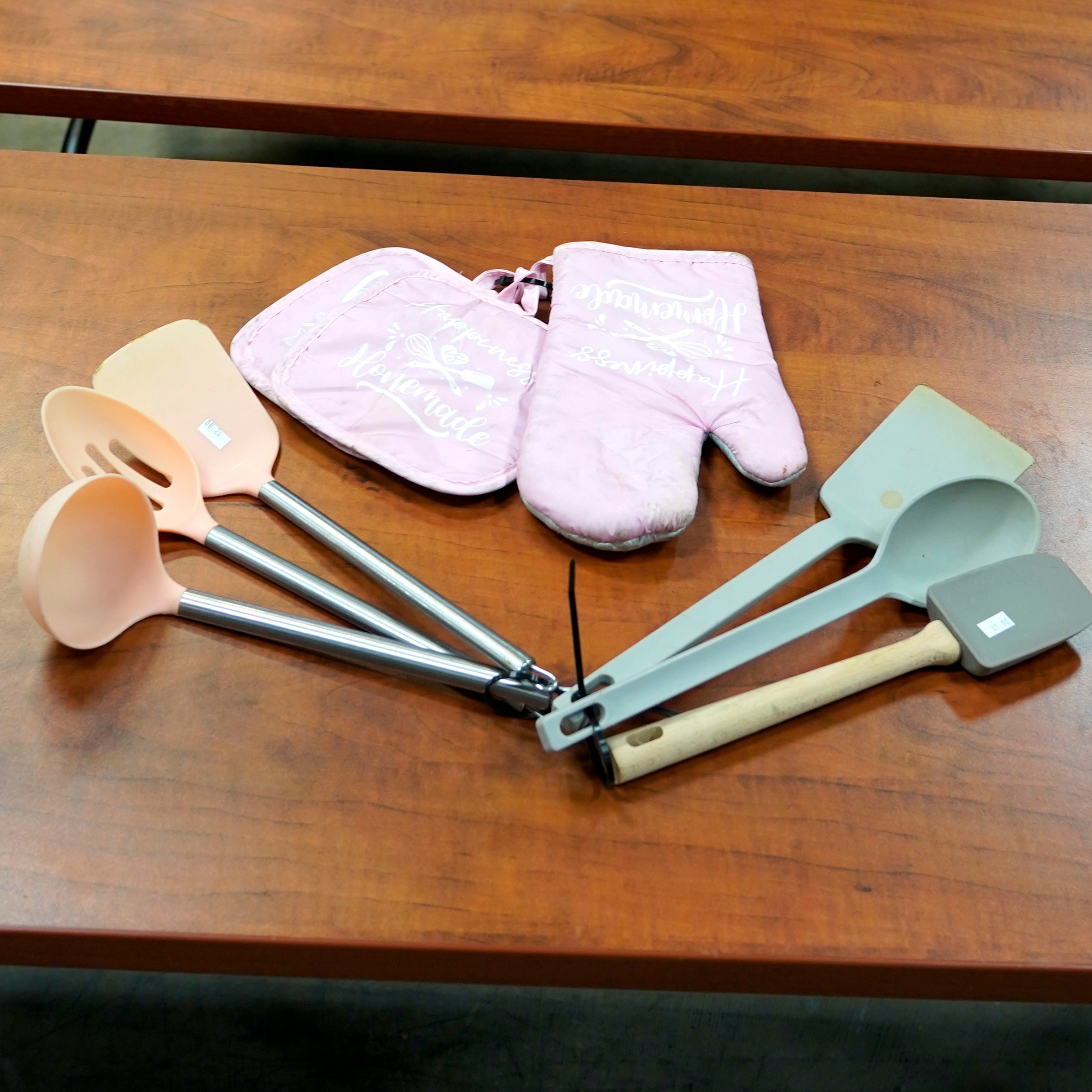 Baking items, including utensils, oven mitts, and a pot holder.