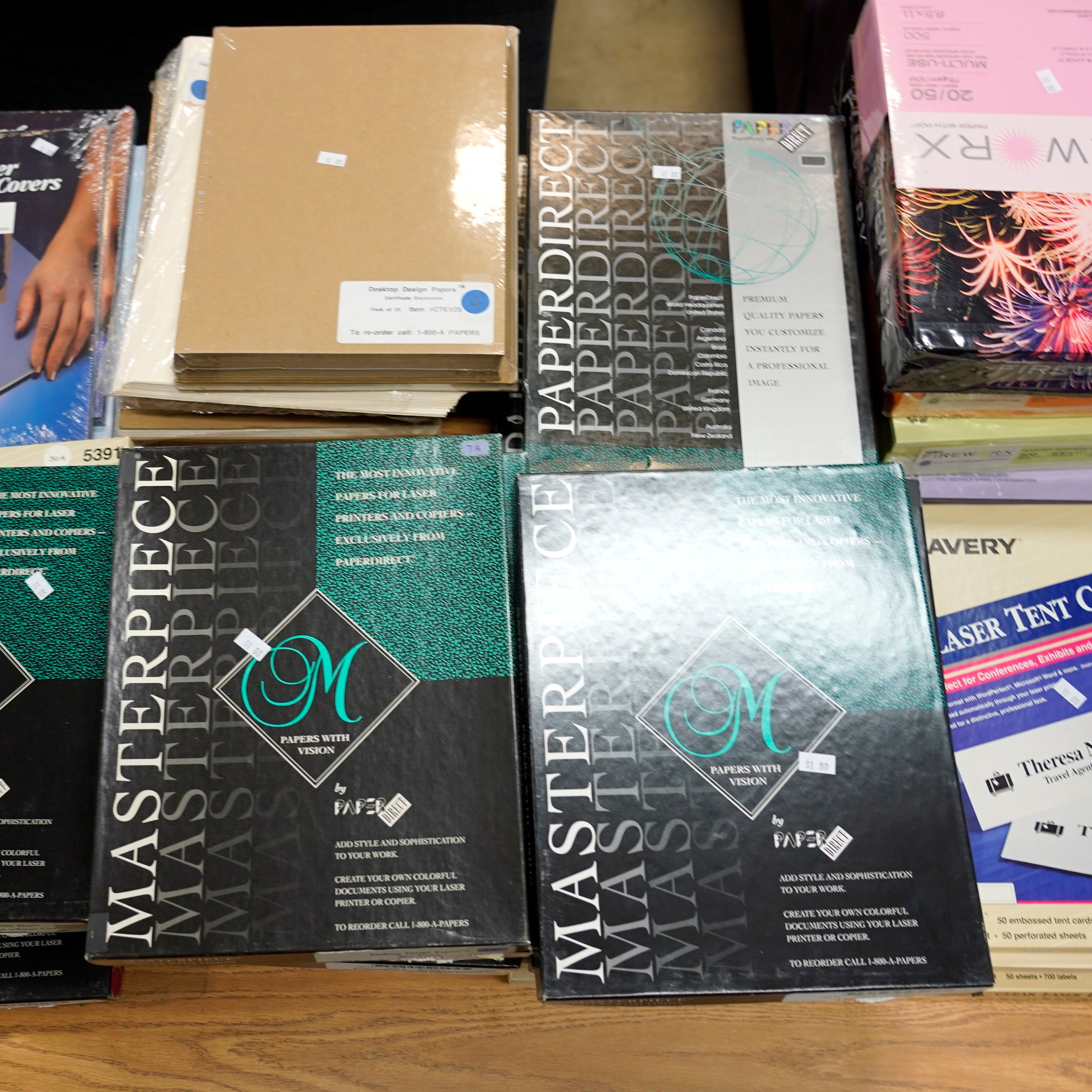 Boxes of paper, labels, and certificate covers.