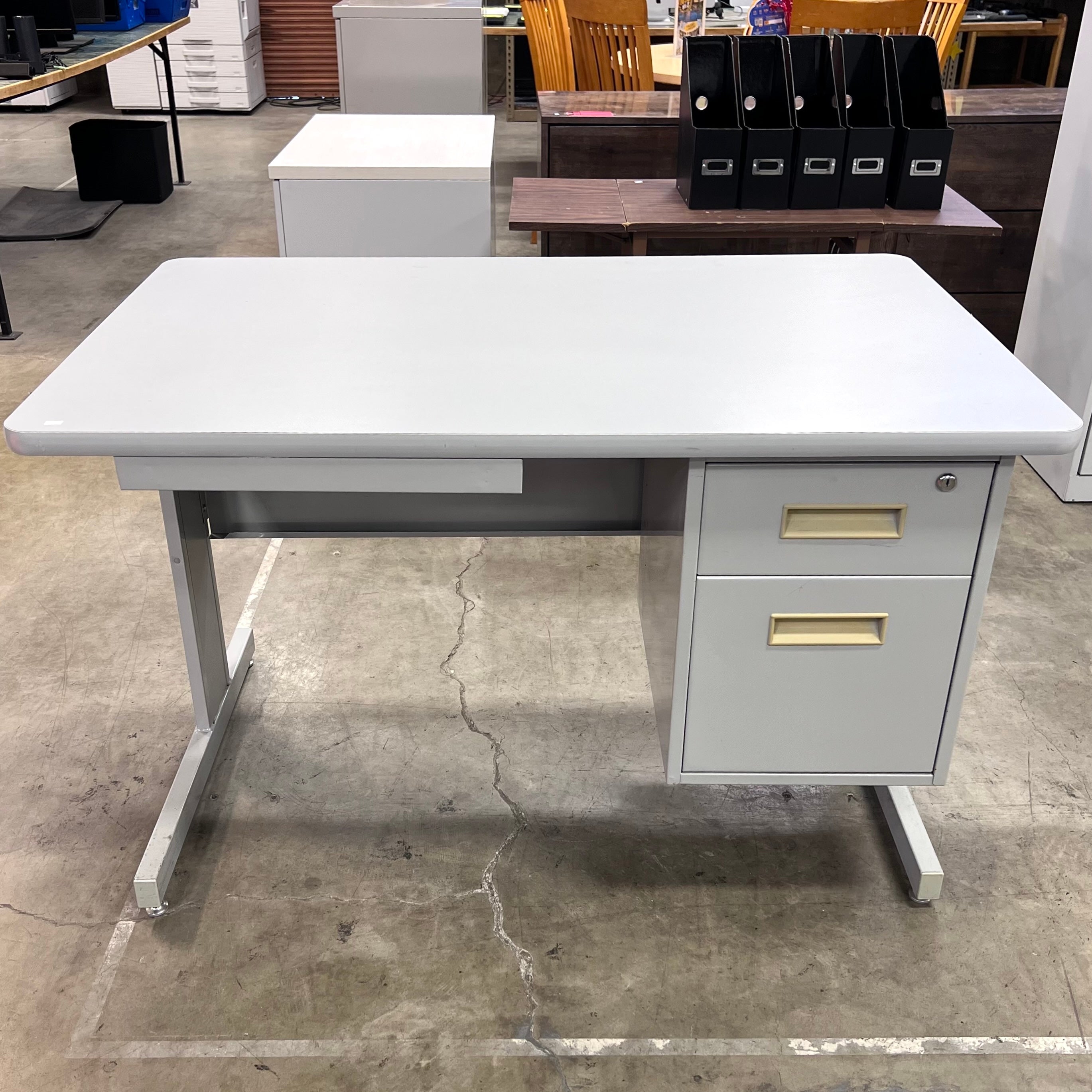 Gray Metal Desk With a Pencil Drawer and Two Side Drawers