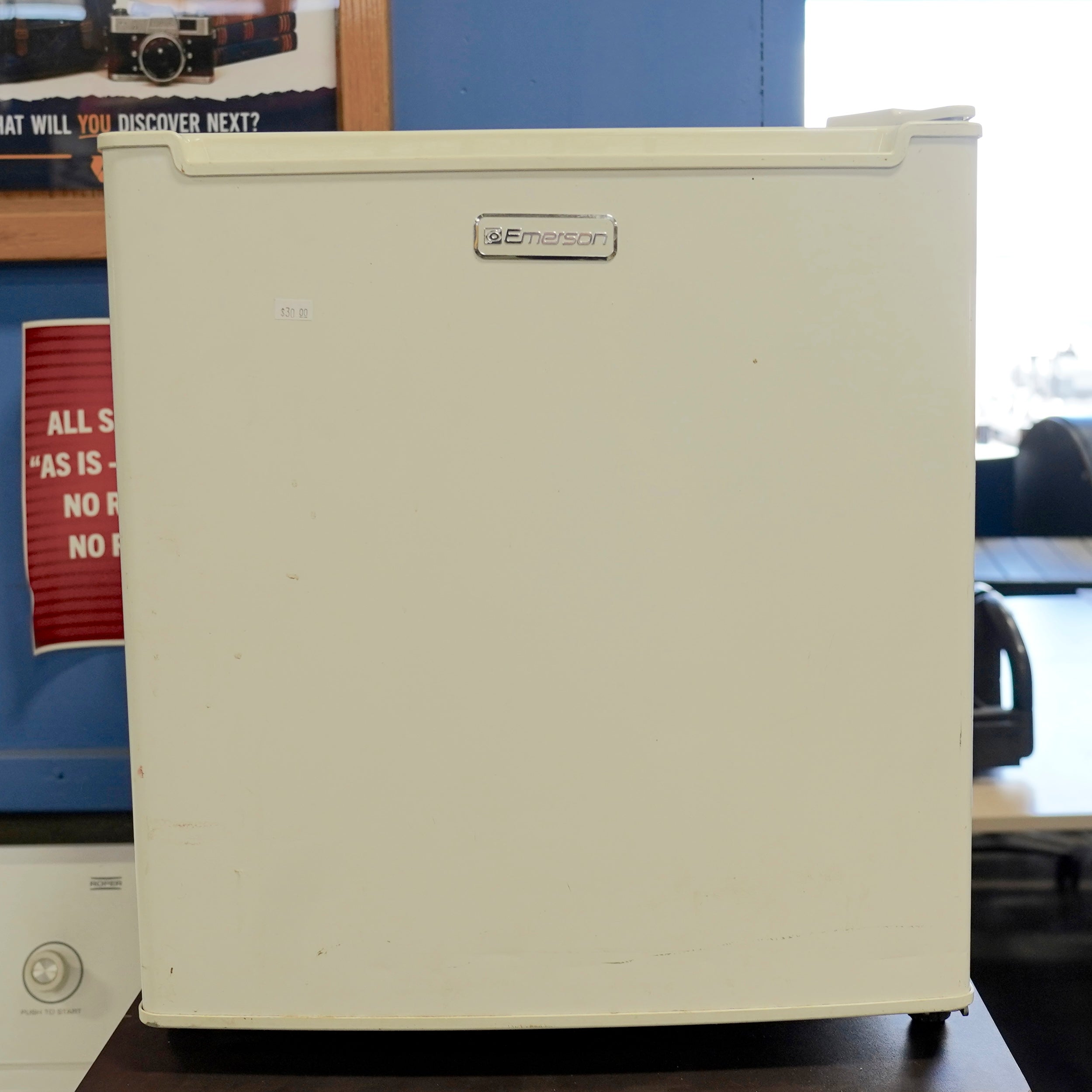 White mini-refrigerator by Emerson.