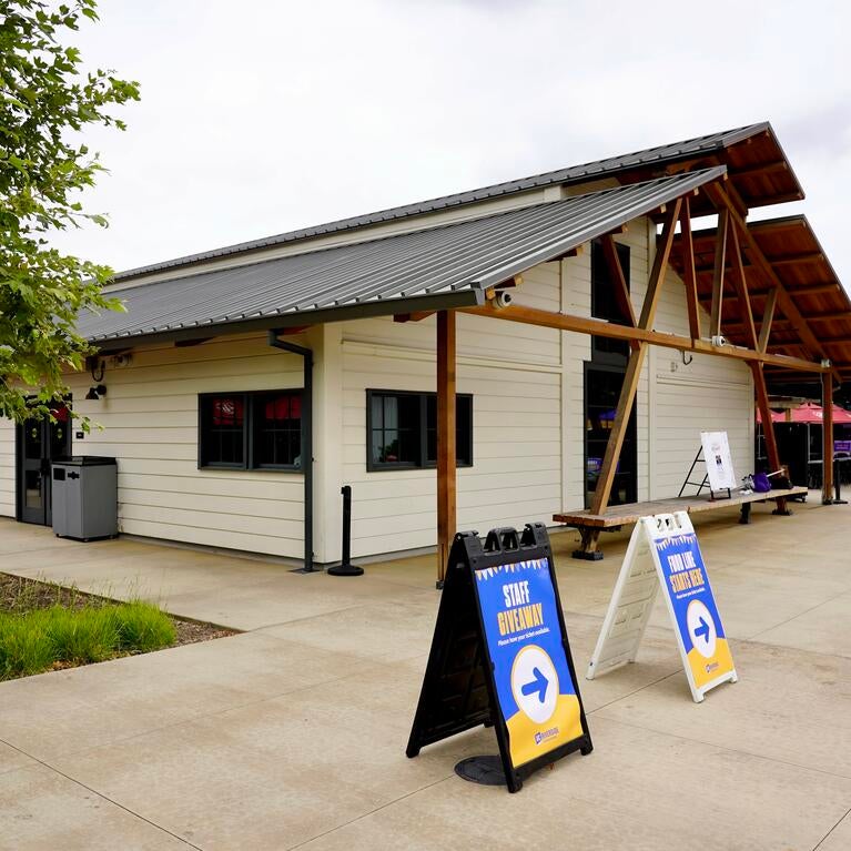 The exterior of the Barn with staff appreciation wayfinding signs.