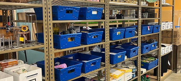 Blue bins filled with various items