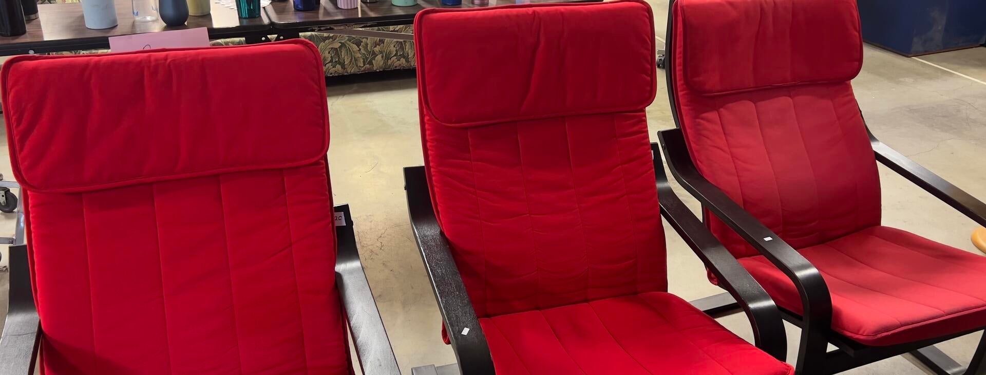 Red cloth chairs with black metal frames