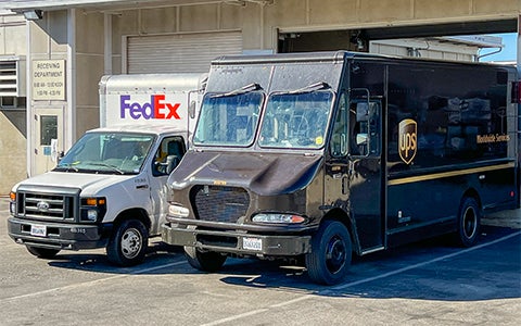 FedEx and UPS Trucks at Receiving Services